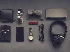 Sample: flat-lay of a wallet, watch, glasses and headphones